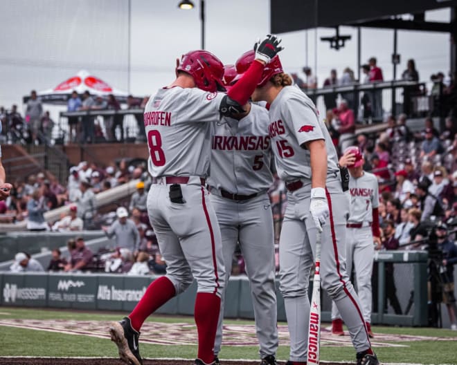 Jace Bohrofen celebrates a two-run homer with teammates in the first inning of the Razorbacks' 6-2 win over the Bulldogs.
