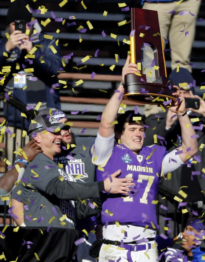 James Madison quarterback Bryan Schor (right) and coach Mike Houston celebrate after winning the FCS national championship in January at Toyota Stadium in Frisco, Texas.