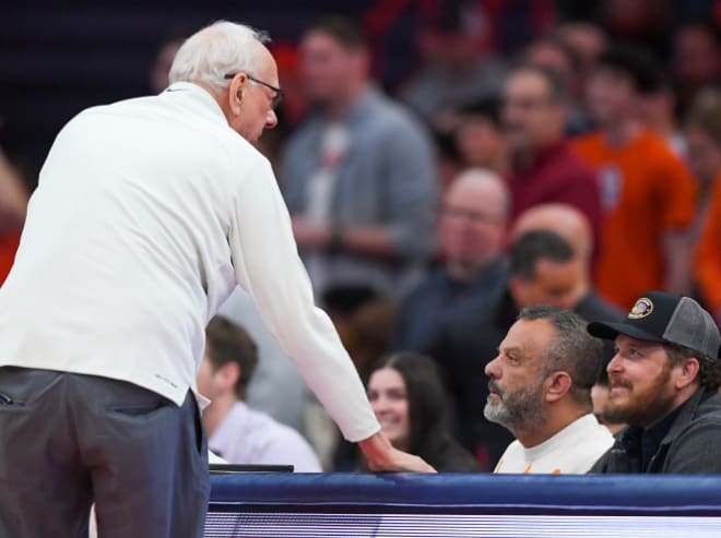 Jan 14, 2023; Syracuse, New York, USA; Syracuse Orange head coach Jim Boeheim (left) talks with businessman Adam Weitsman (center) and actor Cole Hauser (right) against the Notre Dame Fighting Irish during the second half at the JMA Wireless Dome. Mandatory Credit: Rich Barnes-USA TODAY Sports