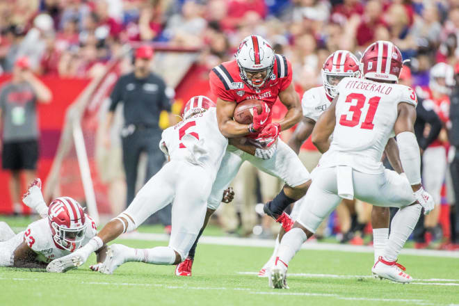 Indiana redshirt sophomore safeties Juwan Burgess (5) and Bryant Fitzgerald (31) break on a Ball State ball carrier in Indiana's season-opener in August. (USA Today Images)