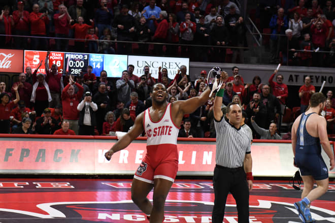 NC State wrestling heavyweight Deonte Wilson gets his hand raised