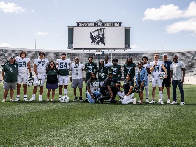 Michigan State's class of 2024 commits pose with their families and Michigan State head coach Mel Tucker at Spartan Stadium during the "Spartan Dawg Con" event (Photo courtesy of Reggie Powers III)