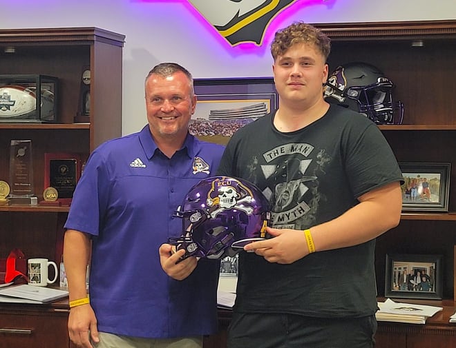Dale High lineman Tyler Weinberger seen with ECU head coach Mike Houston who delivered an scholarship offer.