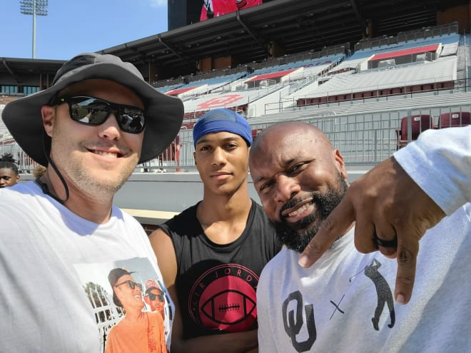 Mike Boganowski and Michael Boganowski alongside then-Oklahoma defensive ends coach Jamar Cain