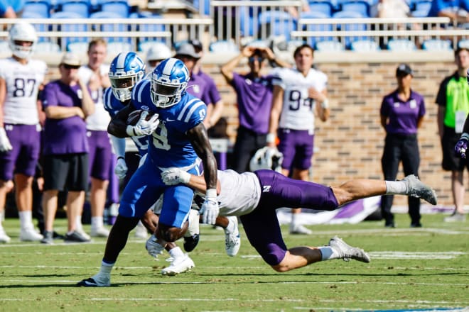 Duke running back Jaquez Moore runs through a tackle attempt against Northwestern. 