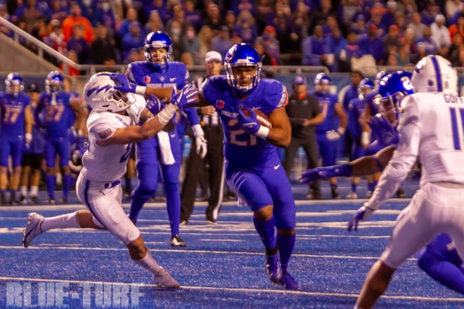 Boise State running back, Andrew Van Buren stiff arms an Air Force defender as he runs into the endzone for a Boise State TD.