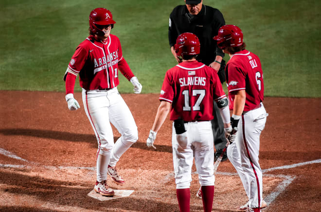 Ben McLaughlin touches home plate after his seventh-inning homer during the Razorbacks' 10-4 win over Texas A&M on Friday.