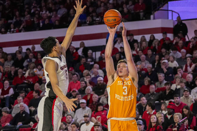 Jan 13, 2024; Athens, Georgia, USA; Tennessee Volunteers guard Dalton Knecht (3) shoots over Georgia Bulldogs guard RJ Melendez (15) during the first half at Stegeman Coliseum.