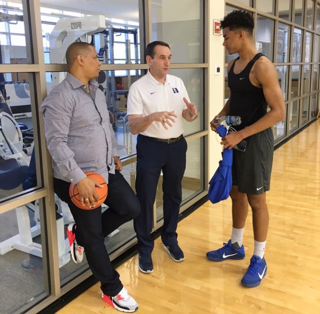Coach K talks to Jordan Tucker on his official visit as father Lew Tucker looks on