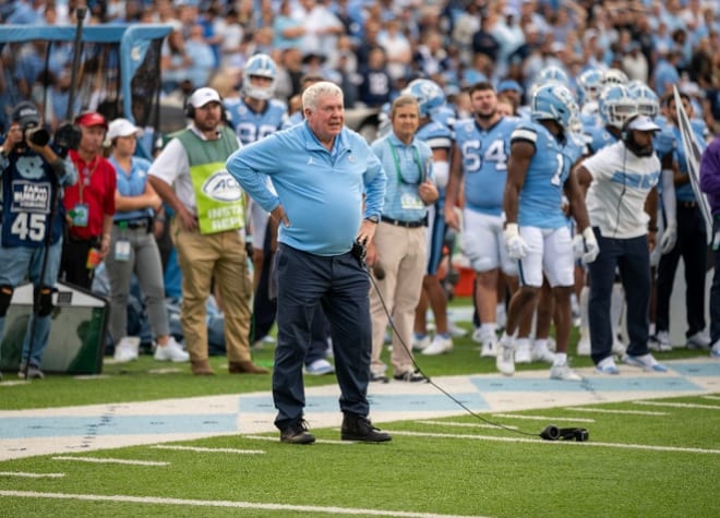 UNC Coach Mack Brown drew a flag after disagreeing with a pass intereference call Saturday.