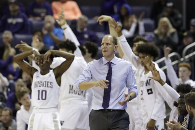 Washington coach Mike Hopkins and players react to a 3-point basket against Mount St. Mary's during the second half of an NCAA college basketball game Tuesday, Nov. 12, 2019, in Seattle. Washington won 56-46. (AP Photo/Elaine Thompson)