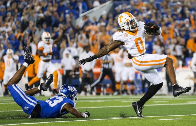 Tennessee Volunteers running back Jaylen Wright (0) dodges Kentucky Wildcats defensive back Andru Phillips (23) to strike first with a Volunteer touchdown early in the first quarter Saturday in Lexington. Oct. 28, 2023.