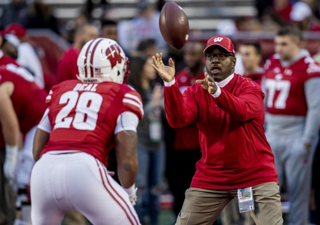 John Settle is leaving Wisconsin after coaching the Badgers running backs for the last six seasons.