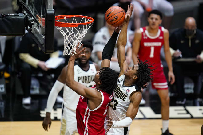 Purdue guard Jaden Ivey (23) comes from behind to block the shot of Wisconsin forward Aleem Ford (2) during the first half. Purdue won, 73-69.