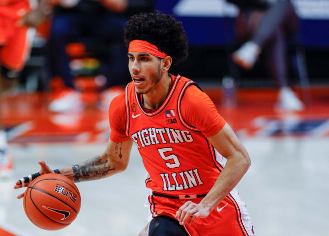 Andre Curbelo #5 of the Illinois Fighting Illini brings the ball up court during the game against the Northwestern Wildcats at State Farm Center on February 16, 2021 in Champaign, Illinois
