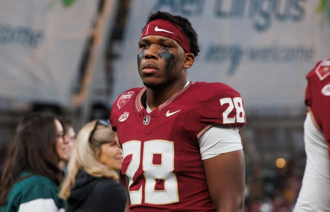 Justin Cryer walks off the field after FSU's loss on Saturday.