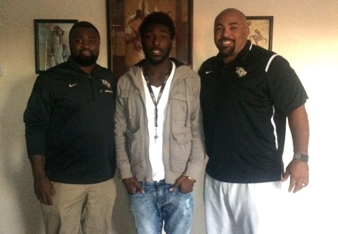 Miami Southridge RB Bentavious Thompson during a recent home visit with UCF coaches Travis Fisher and Jovan Dewitt.