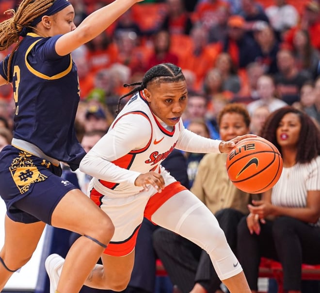Syracuse guard Dyaisha Fair (right) drives by Notre Dame guard Hannah Hidalgo. The two stars accounted for a combined 59 points in the Orange's upset win on Sunday.