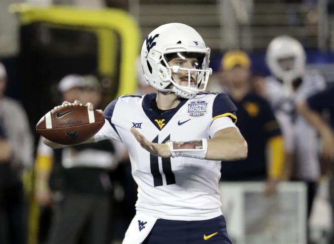 West Virginia quarterback Jack Allison looks to throw during the Mountaineers' Camping World Bowl loss to Syracuse this past December.