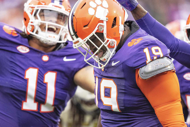 Clemson true freshman defensive tackle Peter Woods (#11) celebrates with tackle DeMonte Capehart (#19) Saturday in Death Valley..