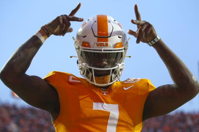 Nov 25, 2023; Knoxville, Tennessee, USA; Tennessee Volunteers quarterback Joe Milton III (7) reacts after running for a touchdown against the Vanderbilt Commodores during the first half at Neyland Stadium. 