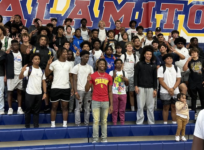 Four-star cornerback Isaiah Rubin poses for a photo with his entire Los Alamitos High School squad after announcing his commitment to USC on Friday.