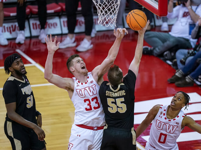 Wisconsin's Chris Vogt (33) blocks a shot by Purdue's Sasha Stefanovic (55) in the first half.