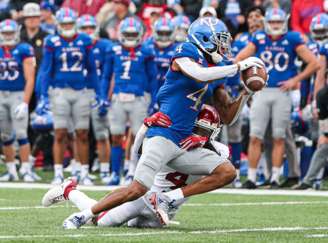 Wide receiver Andrew Parchment fights for yards against Oklahoma during his junior season at Kansas.