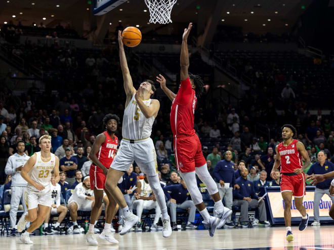 Notre Dame guard Cormac Ryan, center in white, gave Notre Dame a lead with less than 10 seconds remaining to beat Radford.