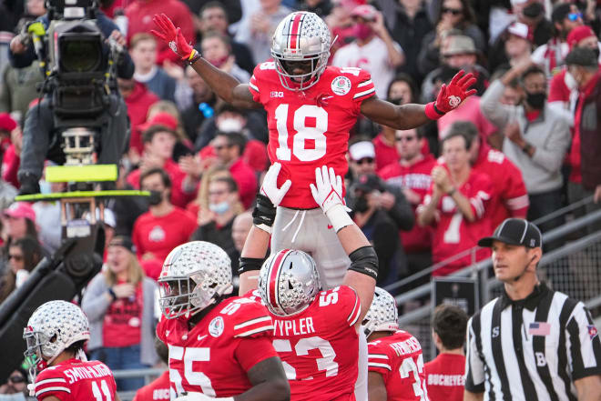 Ohio State wide receiver Marvin Harrison Jr., right, catches a touchdown  during the first half in the Rose Bowl NCAA college football game against  Utah Saturday, Jan. 1, 2022, in Pasadena, Calif. (