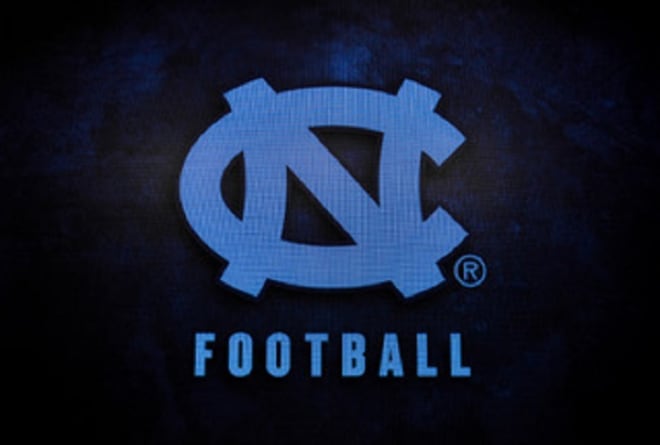 UNC football coach Mack Brown shows highlights and discusses the new prospects that signed Wednesday morning.