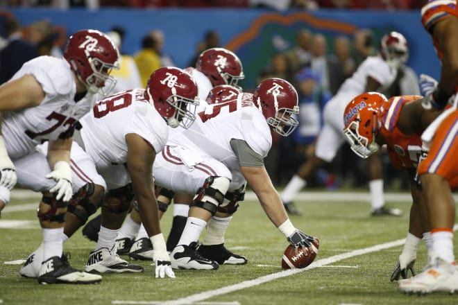 Alabama Crimson Tide offensive lineman Bradley Bozeman (75) at the line of scrimmage against the Florida Gators during the first quarter of the SEC Championship college football game at Georgia Dome.