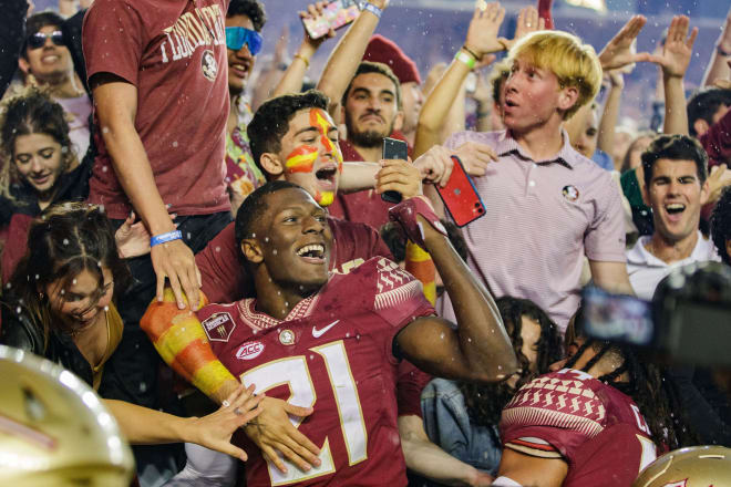FSU receiver Darion Williamson celebrates with fans in the stands after the Seminoles knocked off Miami this past season.