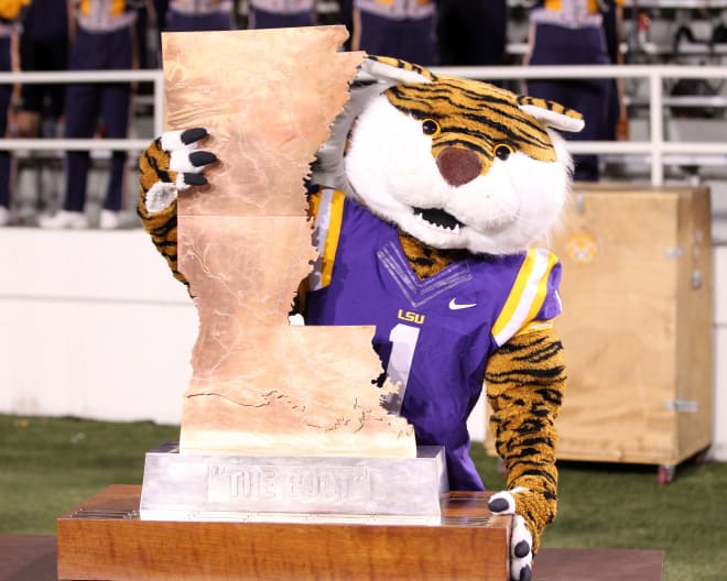 The LSU tiger mascot with the Boot.