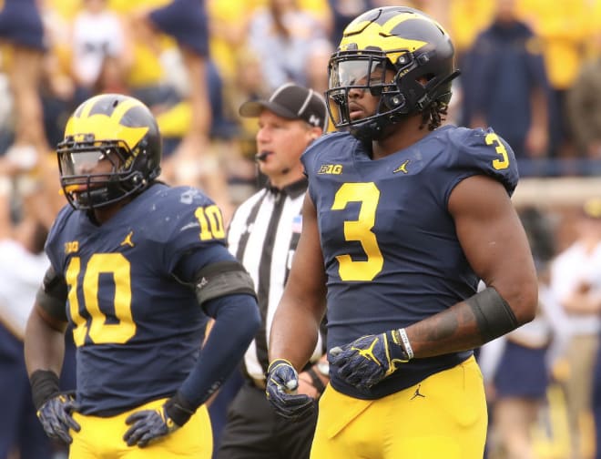 Junior linebacker Devin Bush (left) was rated as a four-star out of high school, while junior defensive end Rashan Gary was a five-star and the No. 1 player in the country.