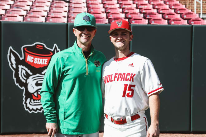 Notre Dame head baseball coach Link Jarrett and son JT, NC State's starting second baseman, share a moment Friday before ND's ACC opener in Raleigh, N.C.