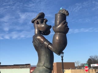 A statue of Popeye the sailor stands in the middle of Popeye's Garden in Alma, Arkansas.