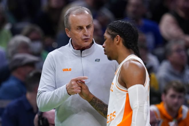 Tennessee head coach Rick Barnes talks with guard Zakai Zeigler, right, during the first half of a college basketball game against Longwood in the first round of the NCAA tournament in Indianapolis, Thursday, March 17, 2022. (AP Photo/Michael Conroy)