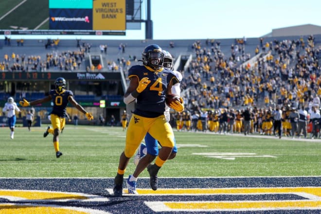 Brown will return for another year with the West Virginia Mountaineers football program.