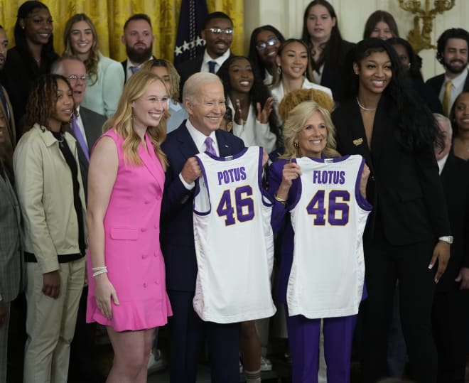 LSU's Angel Reese, right, and Emily Ward, left, present President Joe Biden and First Lady Jill Biden jerseys as they visit White House celebrating the Lady Tigers' 2023 NCAA women's basketball title.