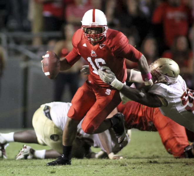 Nov. 13, 2010 - Raleigh, Carter-Finley Stadium, United States of America - NC  State quarterback Russell Wilson (#16) talks with linebacker Nate Irving  (#56) late in the game. NC State wins big