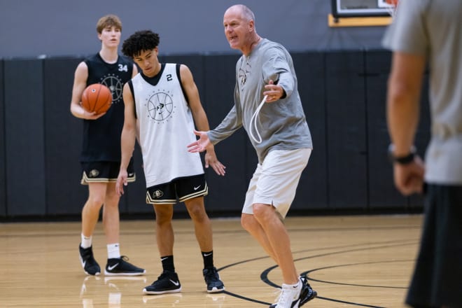 Tad Boyle speaks during an August practice in Boulder with freshmen K.J. Simpson (2) and Lawson Lovering (34) watching