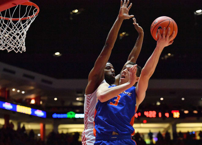ALBUQUERQUE, NEW MEXICO - DECEMBER 04: Justinian Jessup #3 of the Boise State Broncos shoots against JaQuan Lyle #5 of the New Mexico Lobos during their game at Dreamstyle Arena - The Pit on December 04, 2019 in Albuquerque, New Mexico.