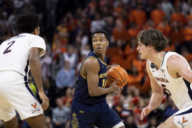 Notre Dame's Marcus Hammond (10) looks for an outlet against Virginia's Reece Beekman (2) and Ben Vander Plas (5) during Saturday's narrow Irish road loss.