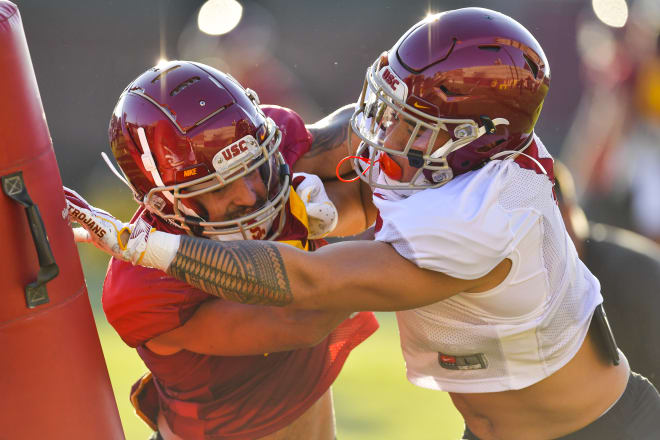 Defensive tackle Brandon Pili, left, will be a key cog in the middle of the defensive line this year with Jay Tufele moving on from the program.