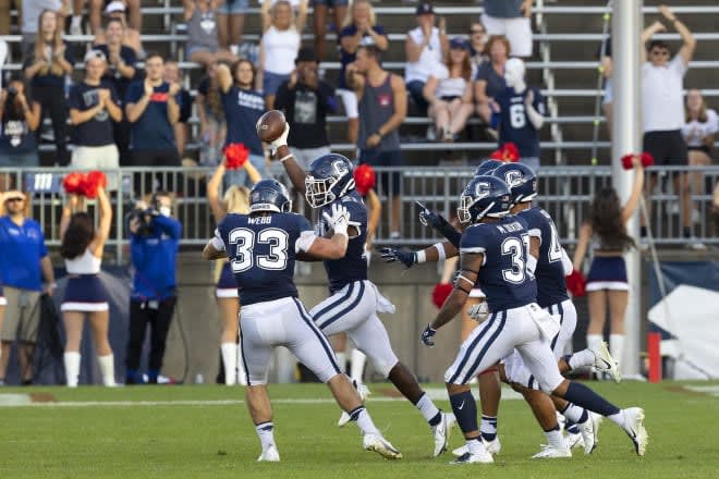 Connecticut cornerback Jeremy Lucien (ball in hand) details his interest in Vandy (Photo: Connecticut Athletics)