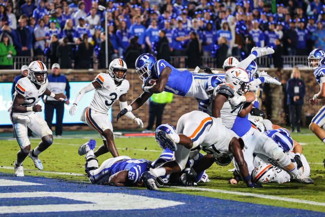 Duke's Jordan Waters dives into the end zone for a touchdown against Virginia. 