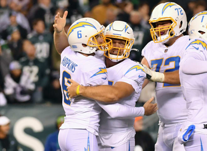 Dustin Hopkins is congratulated after his game-winning kick Sunday for the Chargers.