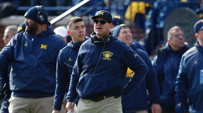 Michigan Wolverines football coach Jim Harbaugh and his team are three touchdown favorites against MSU.