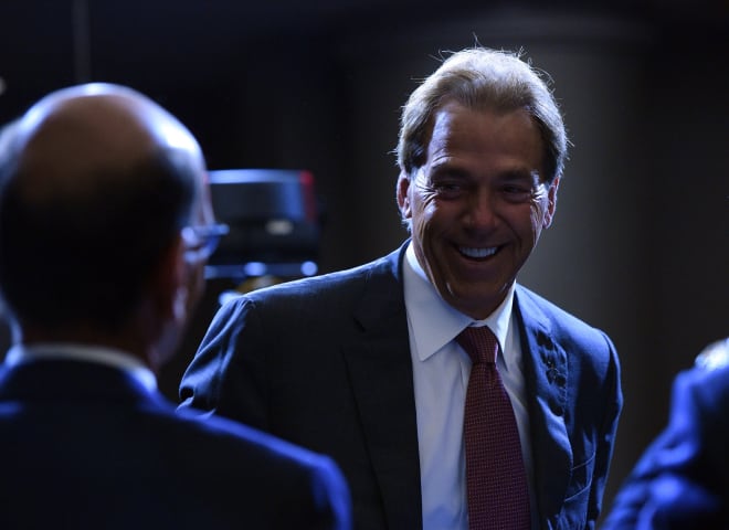 Paul Finebaum, left, talks to Alabama head coach Nick Saban, right. Photo | Imagn 